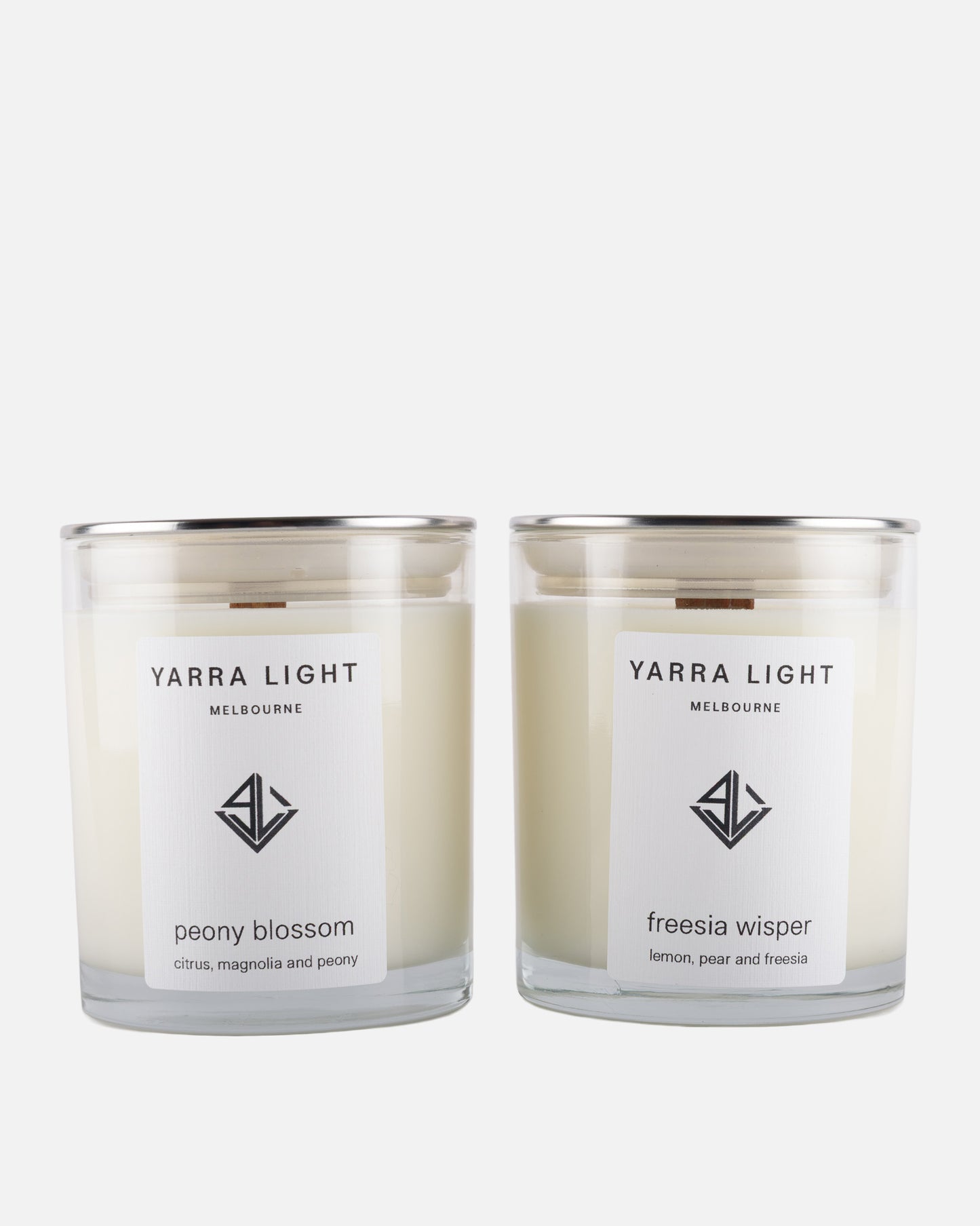 Two Yarra Light soy wax candles on a white background