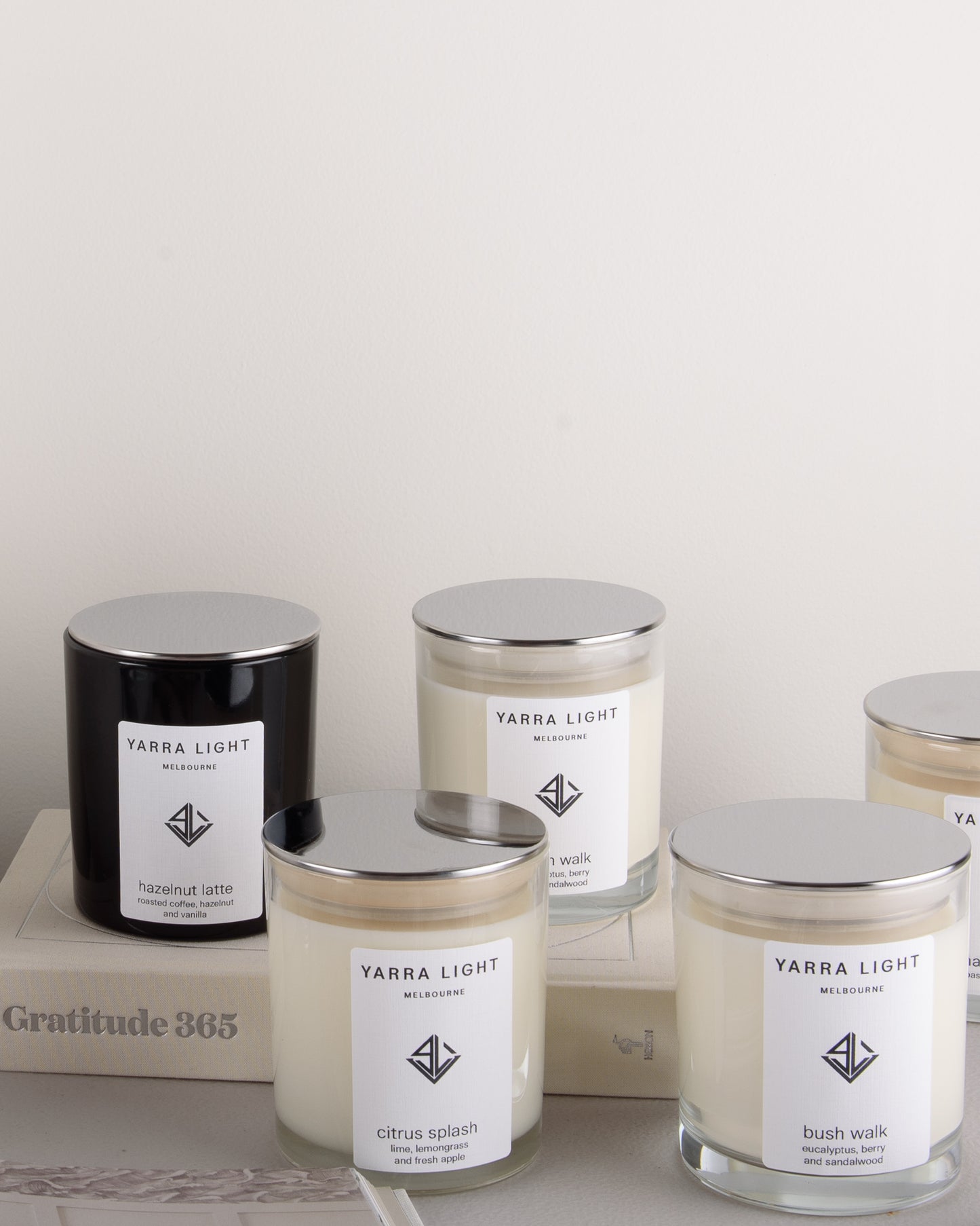 Collection of Yarra Light soy wax candles on a neutral background