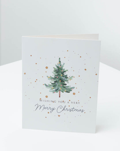 Christmas card with a green watercolour Christmas tree and gold dots, reading Wishing you a very Merry Christmas