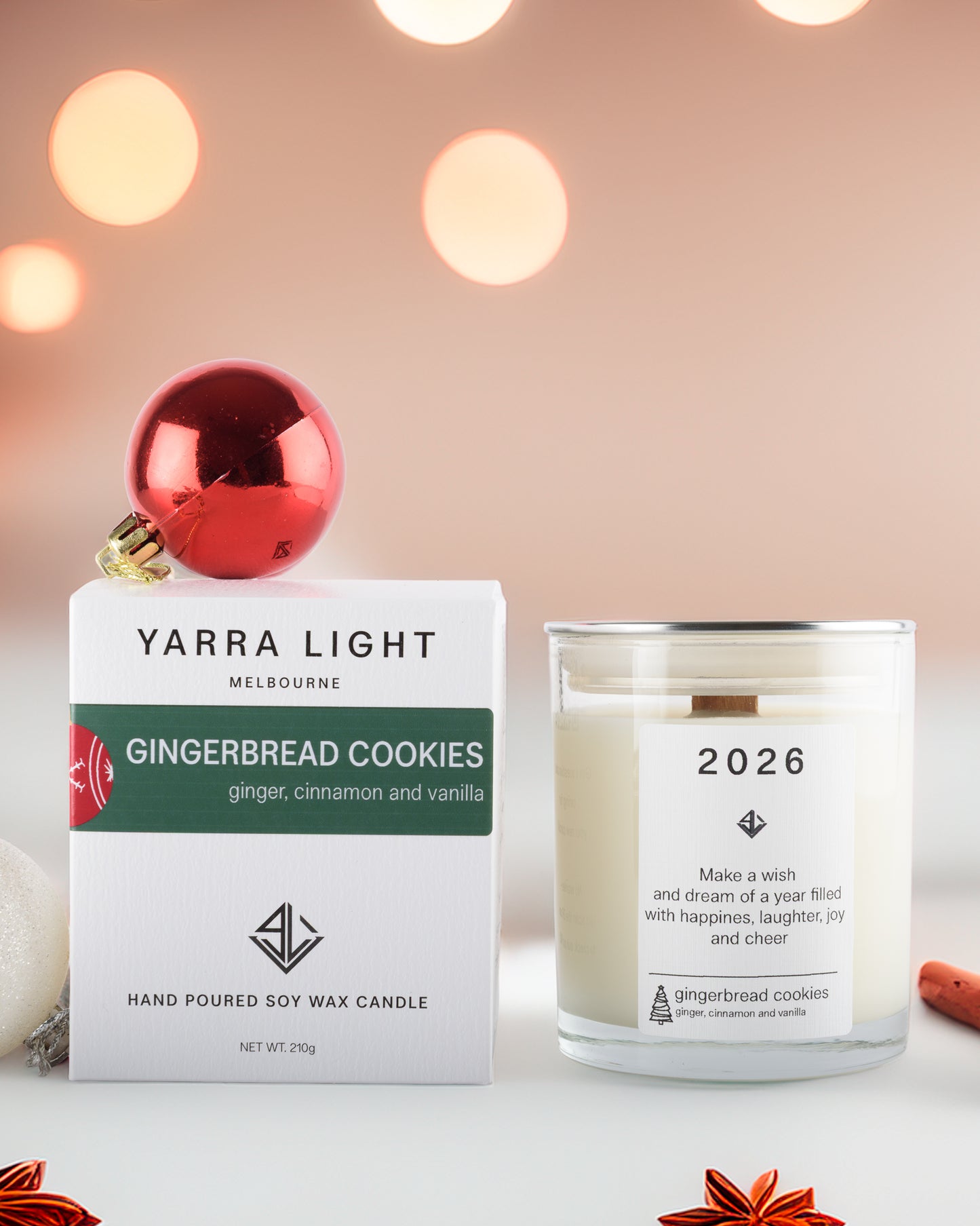 Yarra Light gingerbread cookies candle packaging with a candle labeled '2026' on a blurred lights background