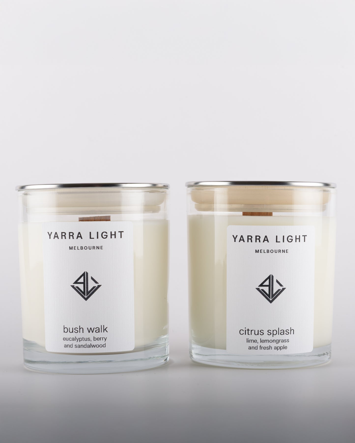 Bundle featuring Citrus Splash and Bush Walk soy wax scented candles with wood wicks in clear glass jars with minimalist labels, inspired by the fresh citrusy notes of orange and grapefruit and the earthy aromas of the Australian bush.
