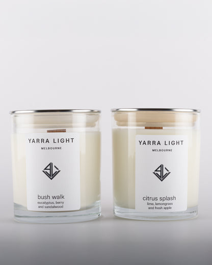 Bundle featuring Citrus Splash and Bush Walk soy wax scented candles with wood wicks in clear glass jars with minimalist labels, inspired by the fresh citrusy notes of orange and grapefruit and the earthy aromas of the Australian bush.