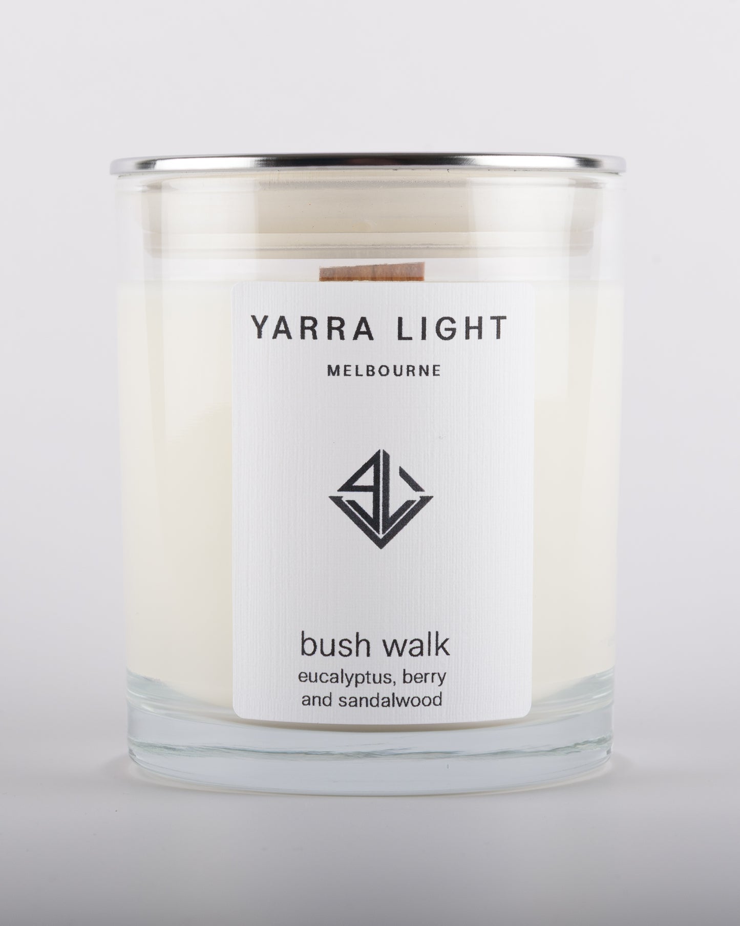 Bush Walk soy wax scented candle in a clear glass jar with minimalist label.