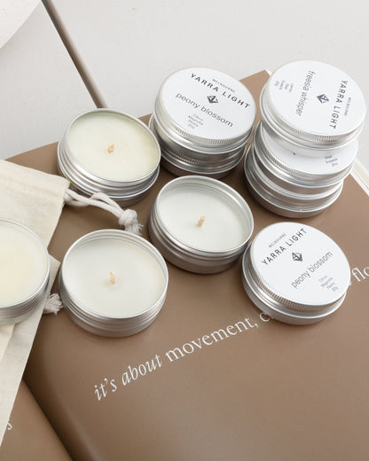 Discovery candle kit featuring ten soy wax scented sample candle tins neatly arranged in a reusable bag, ideal for trying a variety of fragrances or gifting.