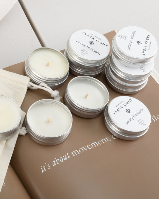Discovery candle kit featuring ten soy wax scented sample candle tins neatly arranged in a reusable bag, ideal for trying a variety of fragrances or gifting.