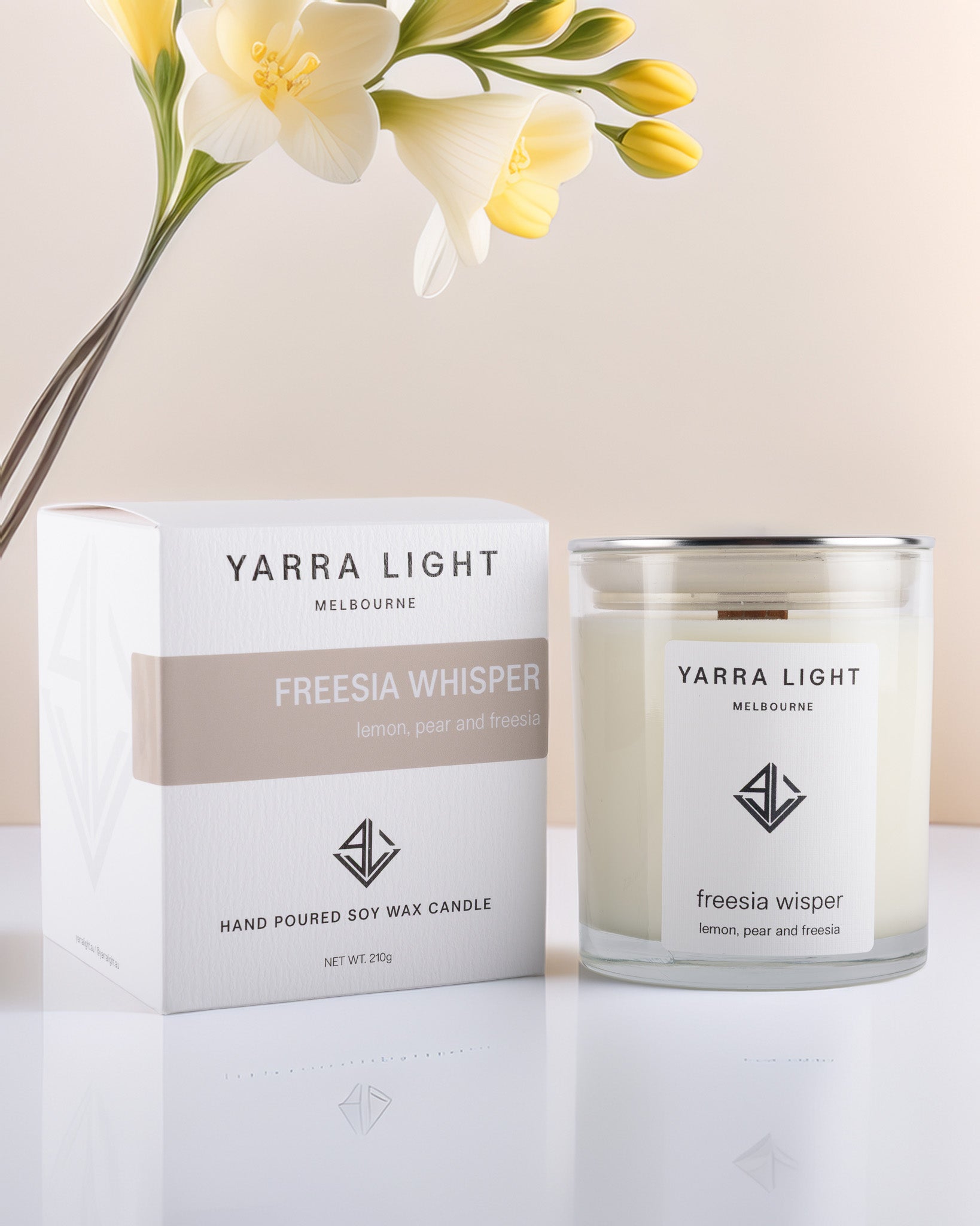 Yarra Light Freesia Whisper soy wax candle and packaging on a light background
