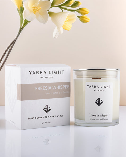 Yarra Light Freesia Whisper soy wax candle and packaging on a light background