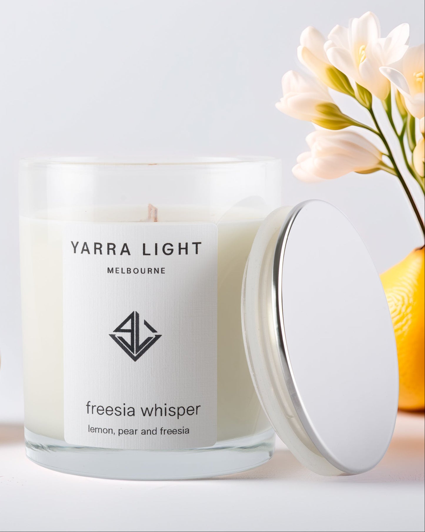 Yarra Light soy candle with a white lid on a light background