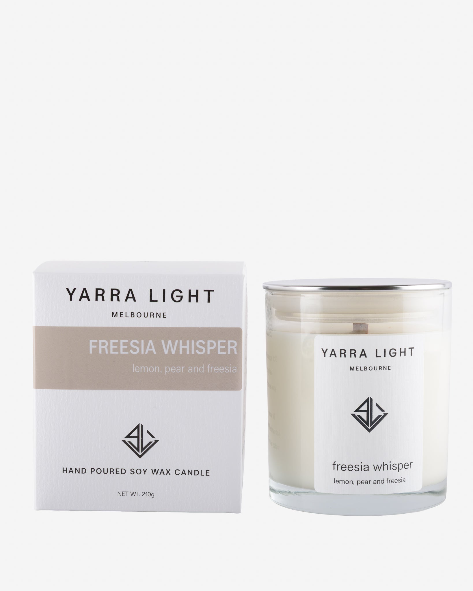 Yarra Light Freesia Whisper soy candle and packaging on a white background