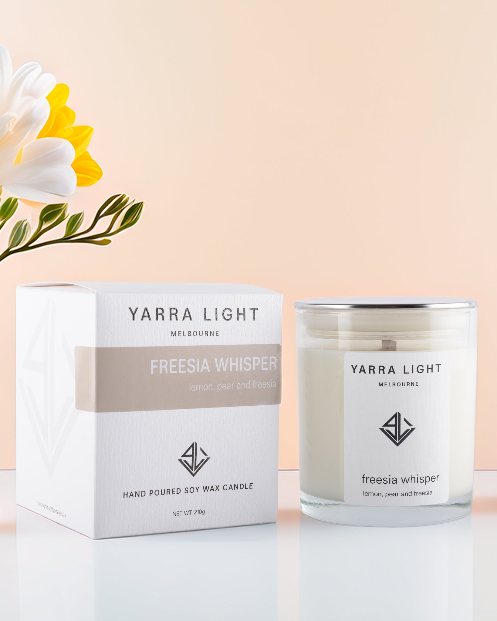 Yarra Light Freesia Whisper soy candle and packaging on a light background