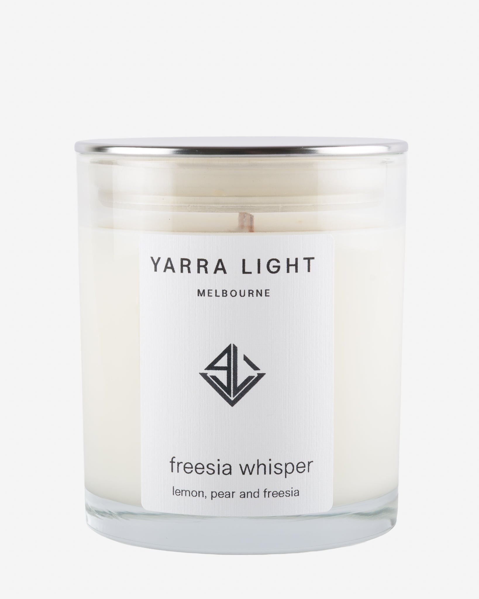 Yarra Light candle with 'freesia whisper' label on a white background