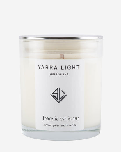 Yarra Light candle with 'freesia whisper' label on a white background