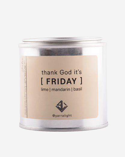 Candle jar with 'thank God it's Friday' label on a white background