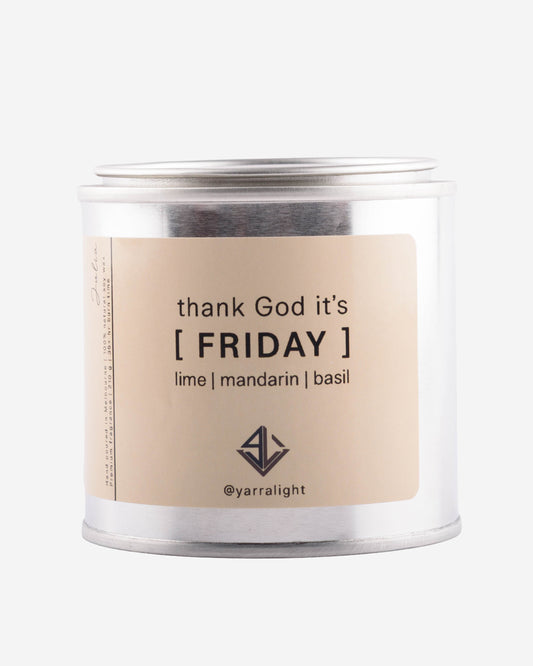 Candle jar with 'thank God it's Friday' label on a white background