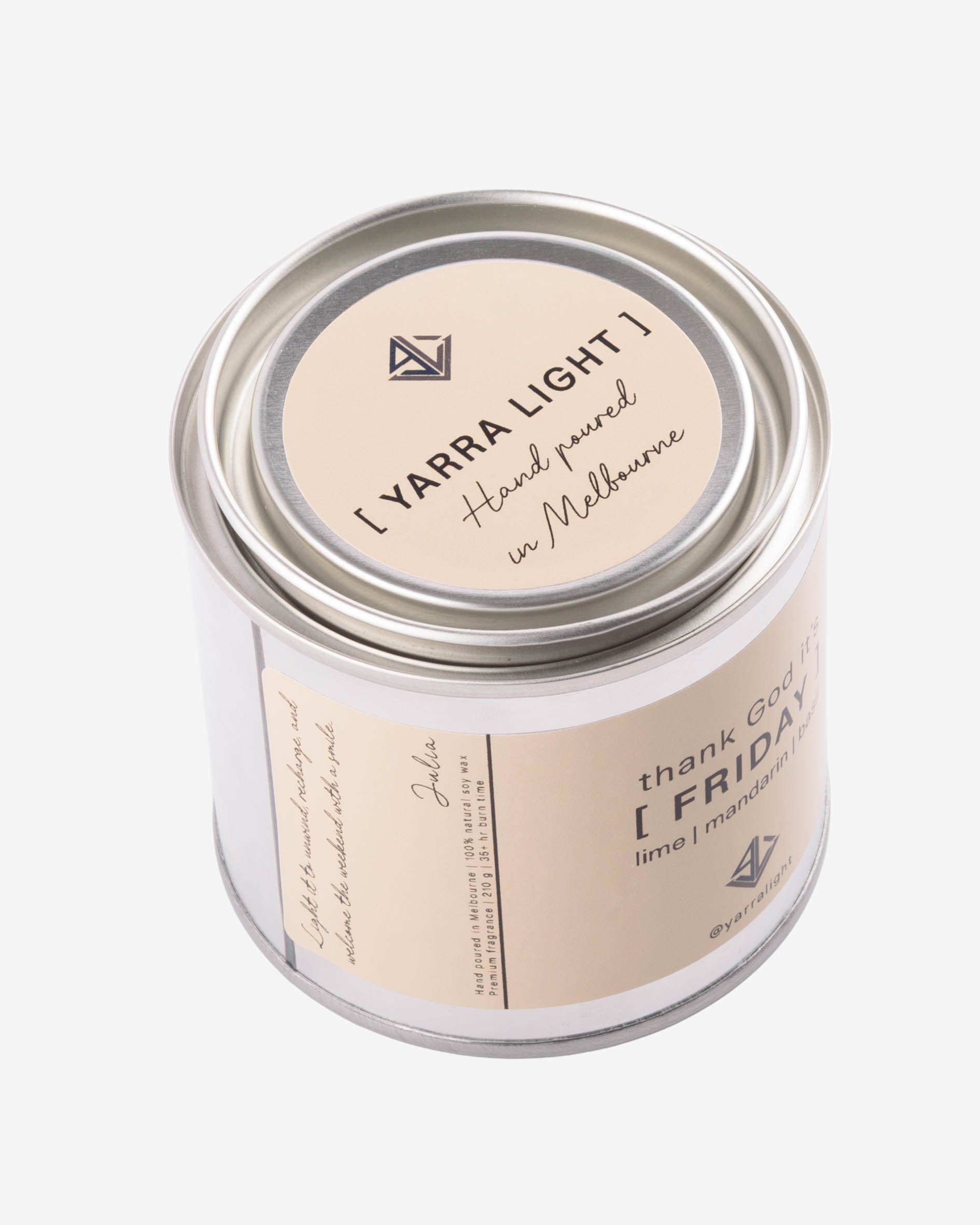 Candle jar with 'Yarra Light' branding on a white background