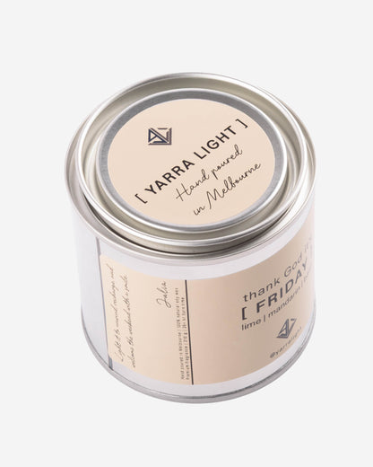 Candle jar with 'Yarra Light' branding on a white background
