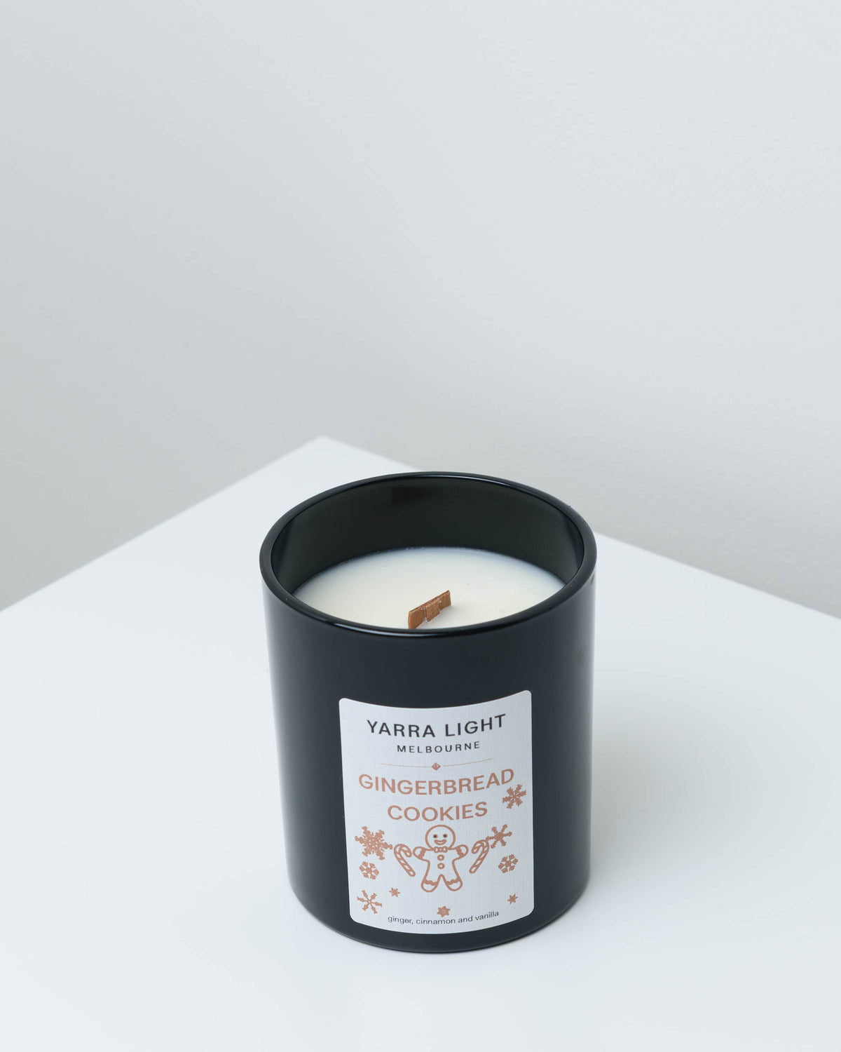 Gingerbread Cookies Christmas soy candle in black glass with a wood wick and a gingerbread man label