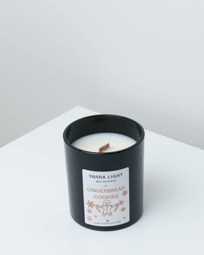 Gingerbread Cookies Christmas soy candle in black glass with a wood wick and a gingerbread man label