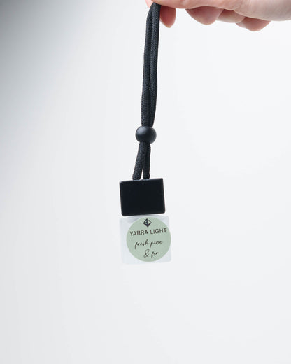Fresh Pine and Fir hanging car diffuser, long-lasting car air freshener in a glass bottle with notes of pine needles, bergamot and fir. 