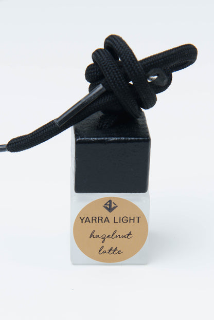 Hazelnut Latte hanging car diffuser, long-lasting car air freshener in a glass bottle with notes of roasted coffee, hazelnut, and creamy vanilla.