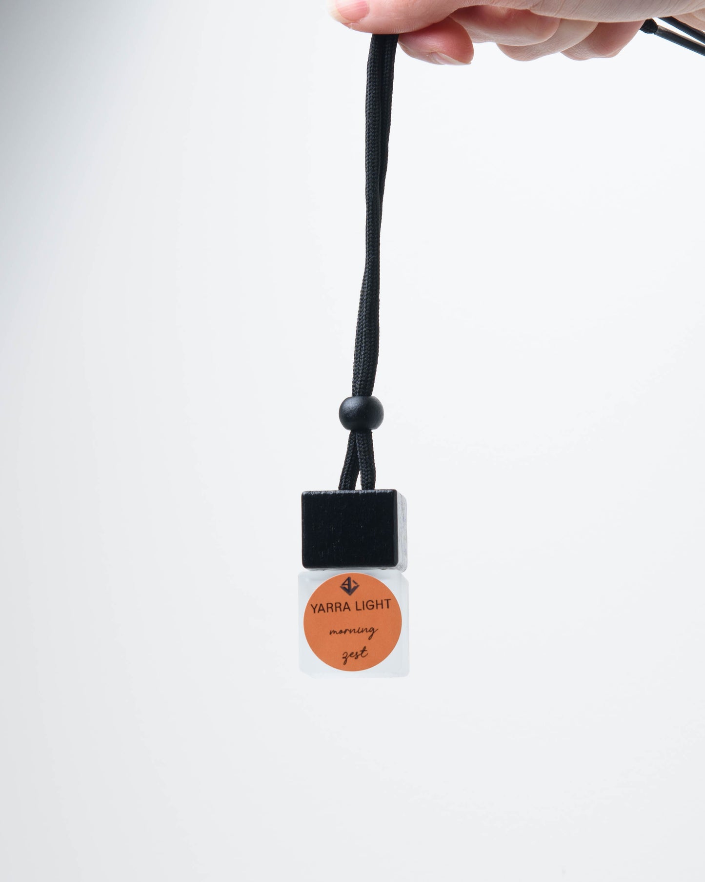 Morning Zest hanging car diffuser with fresh citrus fragrance, long-lasting car air freshener in a stylish glass bottle.