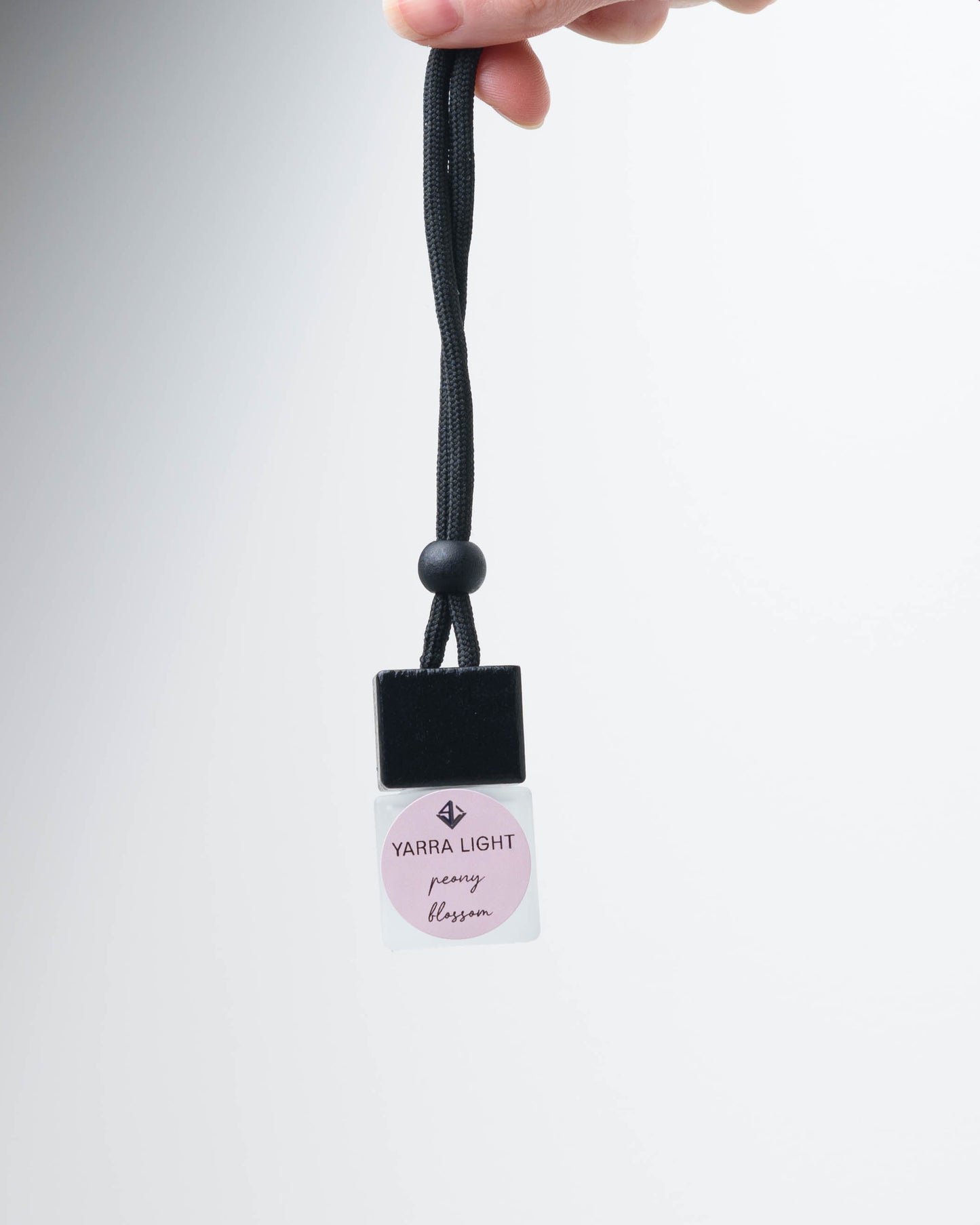 Peony Blossom hanging car diffuser, long-lasting car air freshener in a glass bottle with notes of citrus, magnolia and peony.