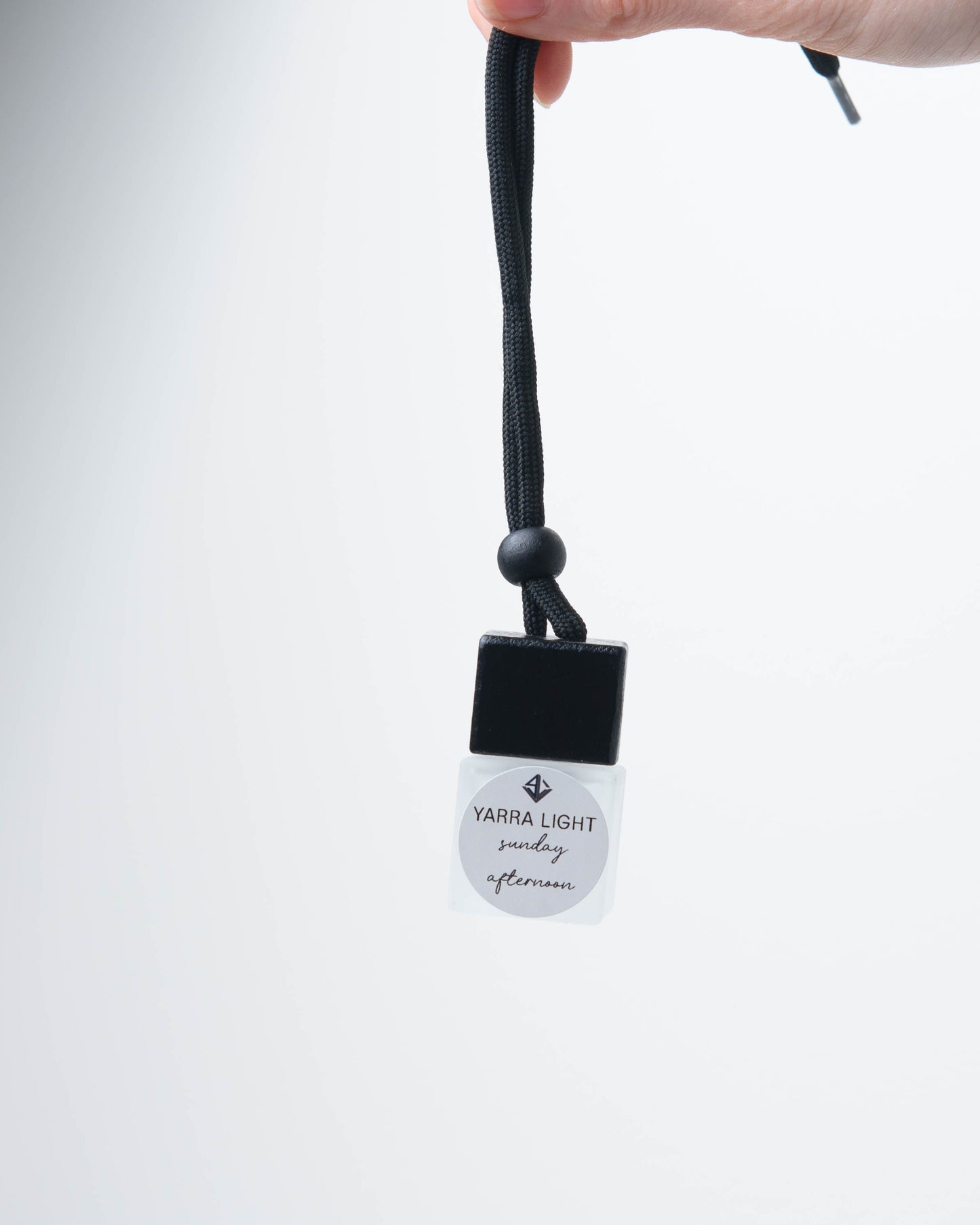 Sunday Afternoon hanging car diffuser, long-lasting car air freshener in a glass bottle with notes of lemon, honeysuckle and jasmine.