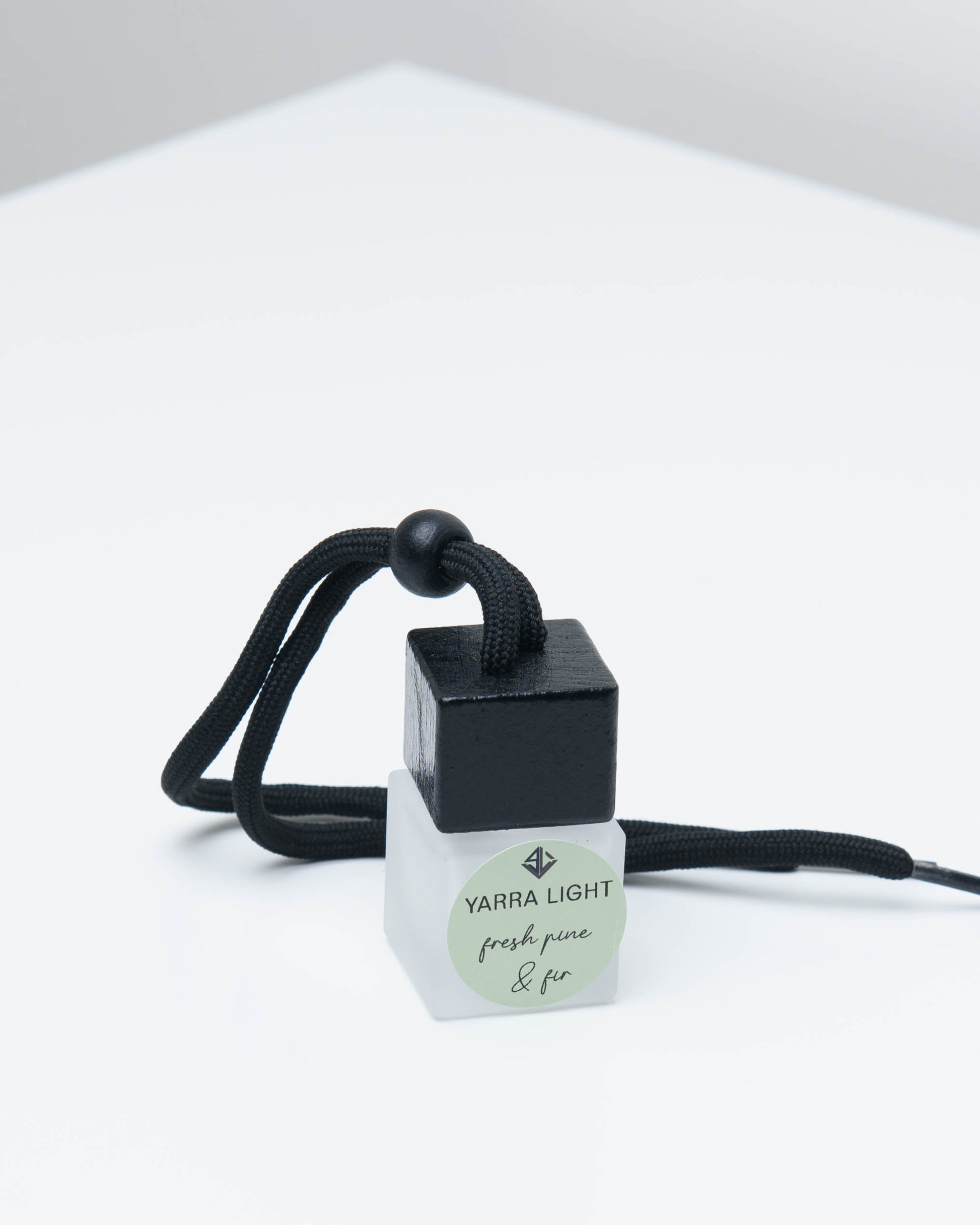 Fresh Pine and Fir hanging car diffuser, long-lasting car air freshener in a glass bottle with notes of pine needles, bergamot and fir. 