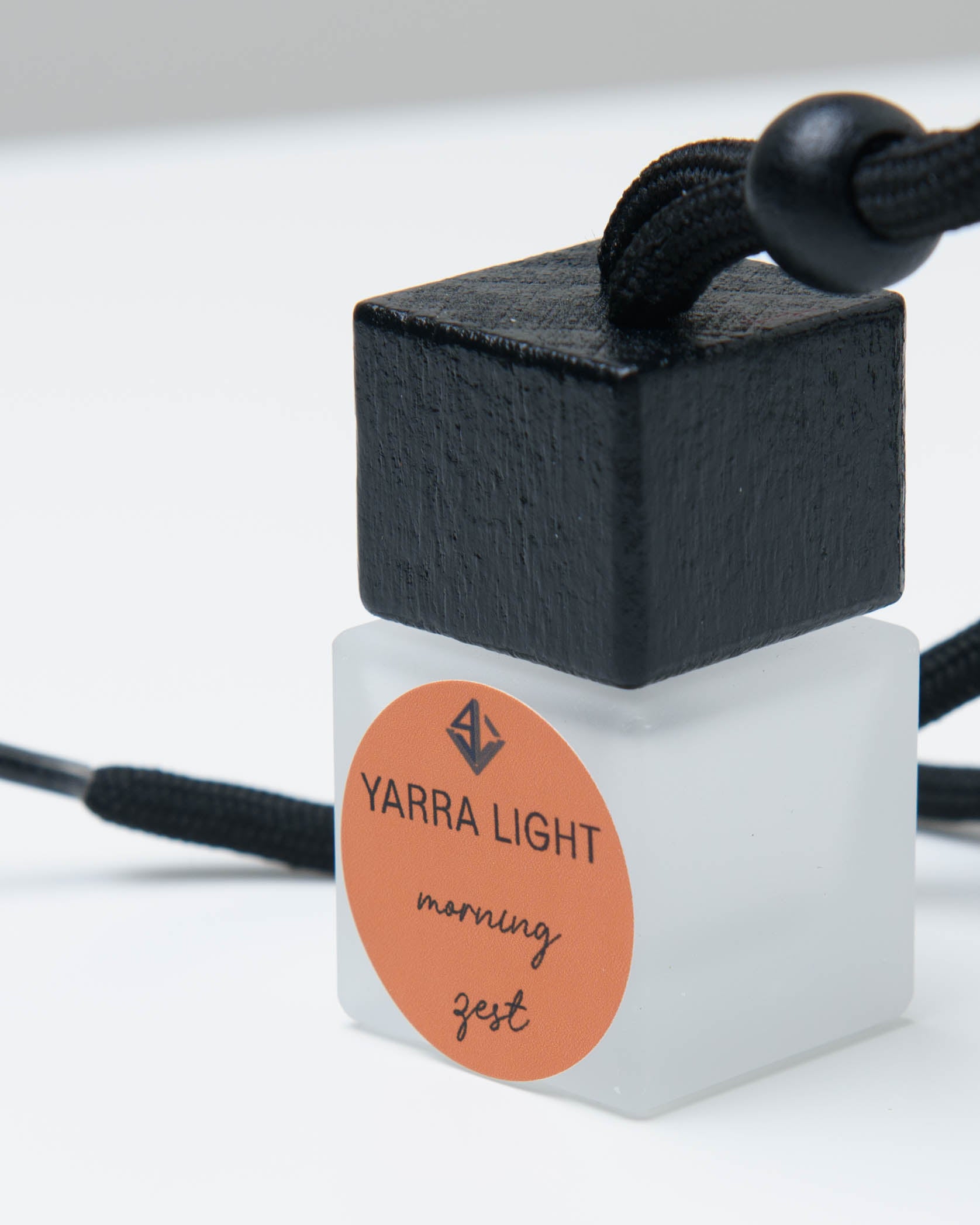 Morning Zest hanging car diffuser, long-lasting car air freshener in a glass bottle with notes of orange, grapefruit and jasmine.