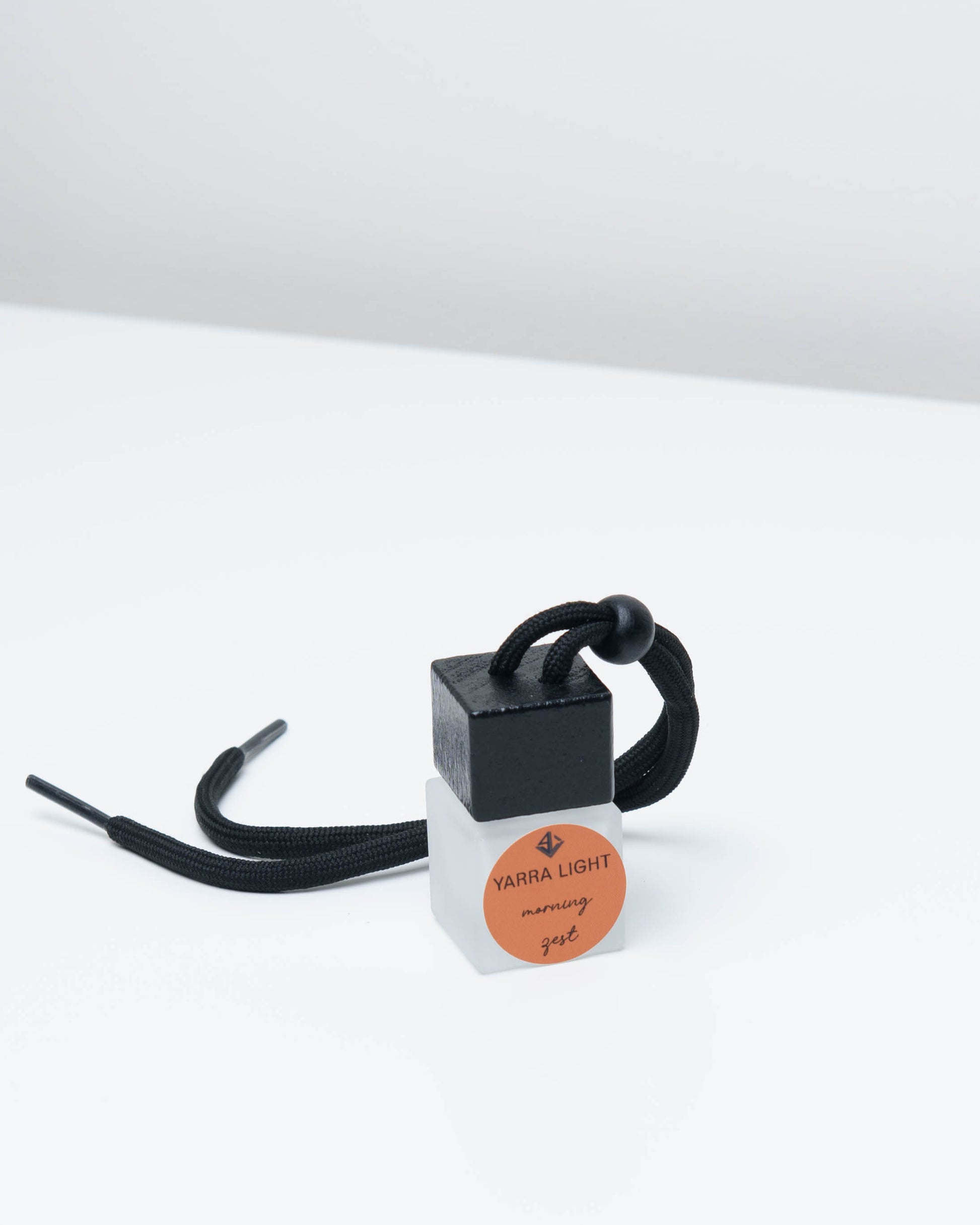 Morning Zest hanging car diffuser, long-lasting car air freshener in a glass bottle with notes of orange, grapefruit and jasmine.