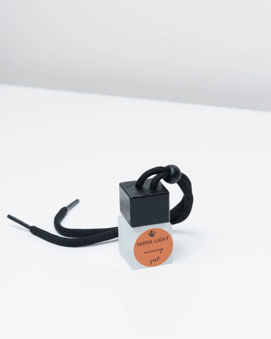 Morning Zest hanging car diffuser in a glass bottle with notes of orange, grapefruit and jasmine.