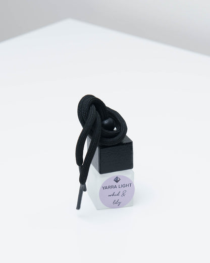 Orchid & Lily hanging car diffuser, long-lasting car air freshener in a glass bottle with notes of orchid, lily and jasmine.