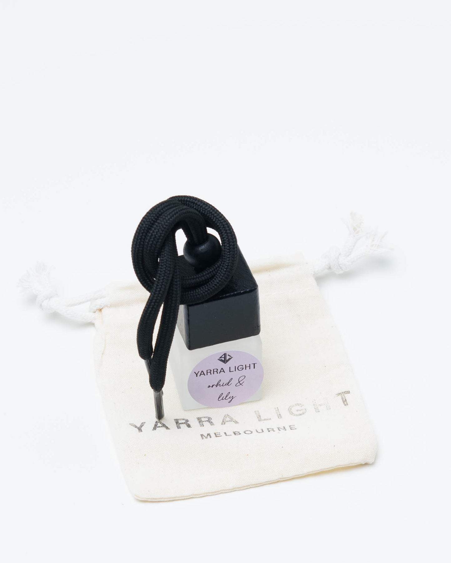Orchid & Lily hanging car diffuser, long-lasting car air freshener in a glass bottle with notes of orchid, lily and jasmine.