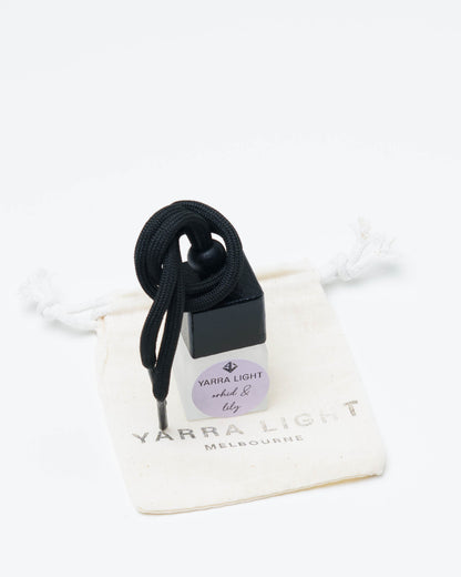 Orchid & Lily hanging car diffuser, long-lasting car air freshener in a glass bottle with notes of orchid, lily and jasmine.