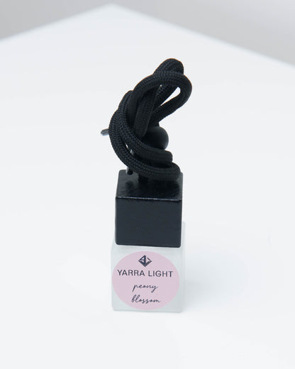 Peony Blossom hanging car diffuser, long-lasting car air freshener in a glass bottle with notes of citrus, magnolia and peony.