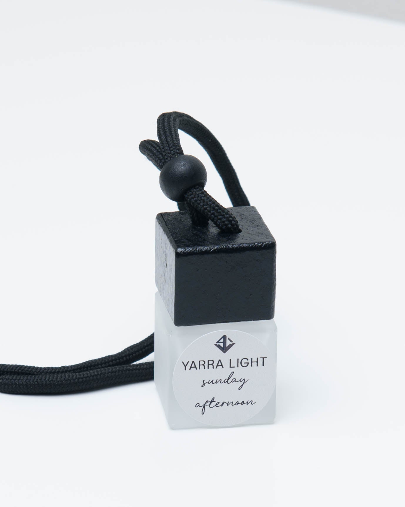 Sunday Afternoon hanging car diffuser, long-lasting car air freshener in a glass bottle with notes of lemon, honeysuckle and jasmine.