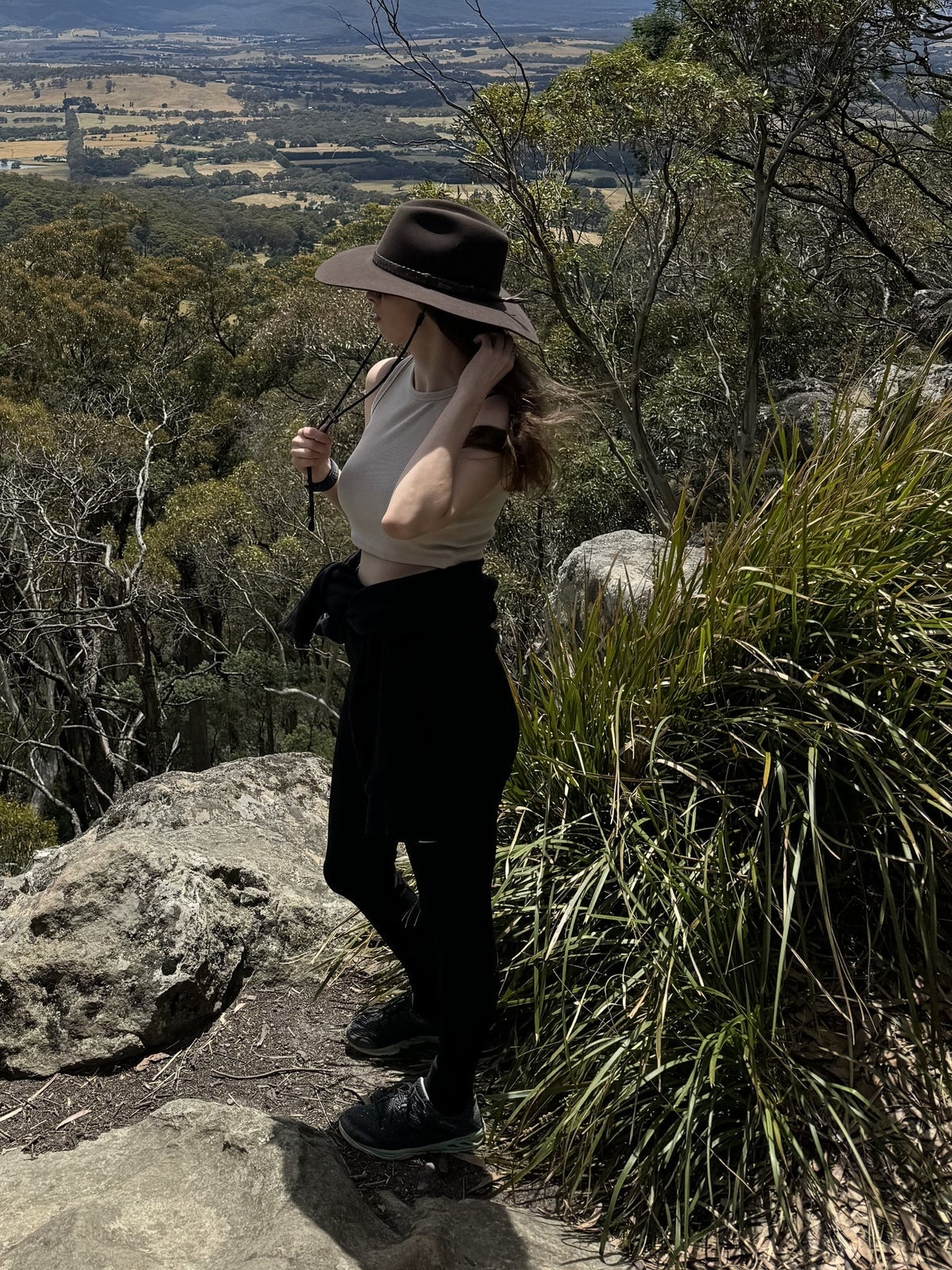 Julia, who hand-pours every Yarra Light candle, on a bush track above the valley in the Macedon Ranges, Victoria
