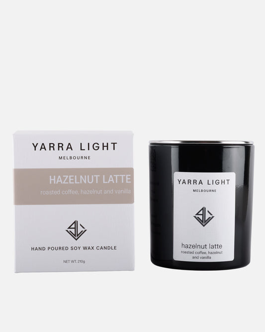 Yarra Light hazelnut latte soy wax candle and packaging on a white background