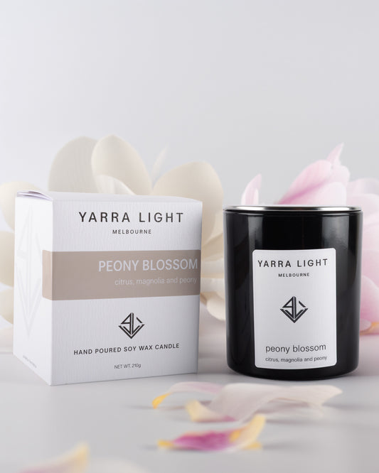 Yarra Light peony blossom soy wax candle and packaging on a light background