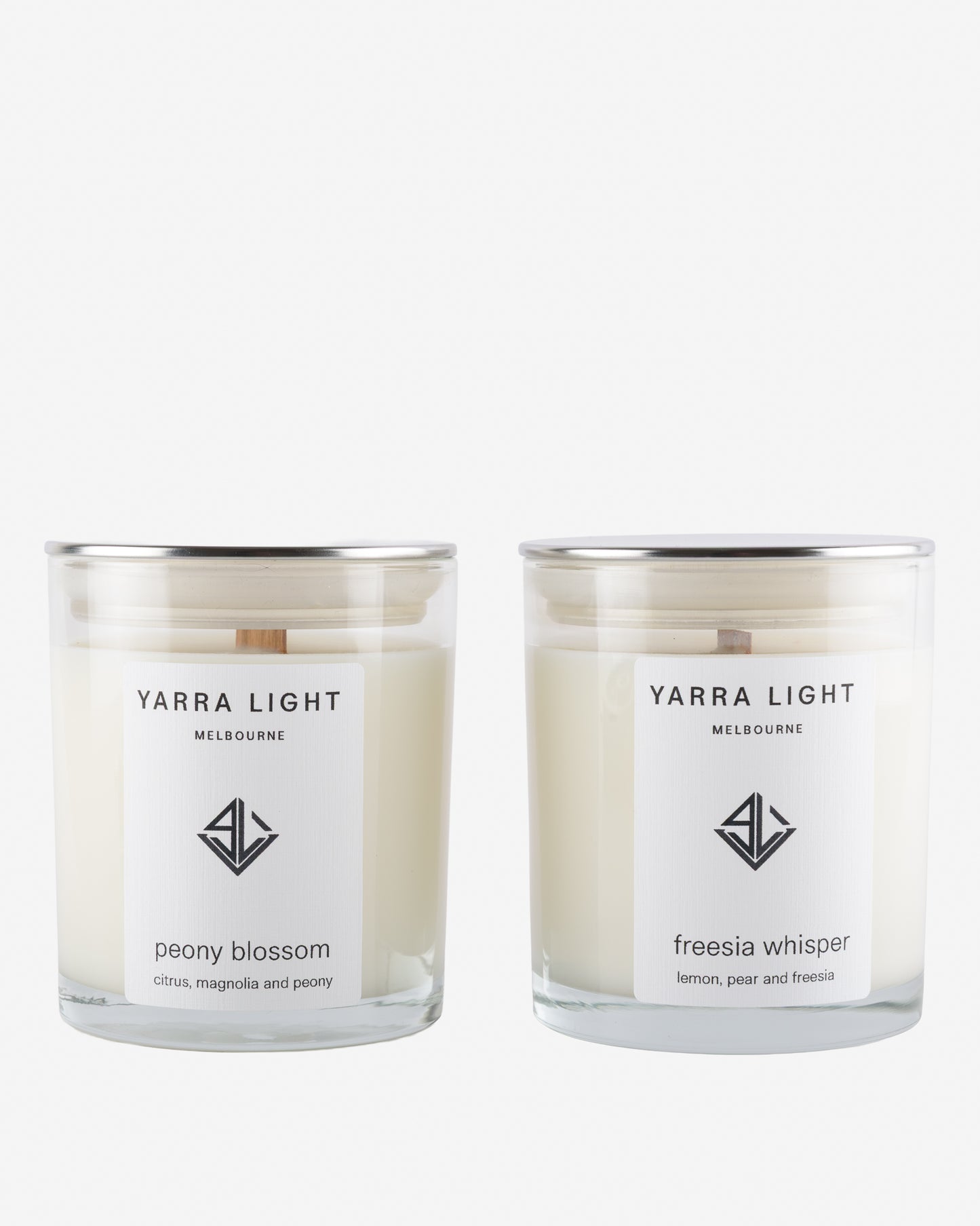Two Yarra Light soy wax candles on a white background
