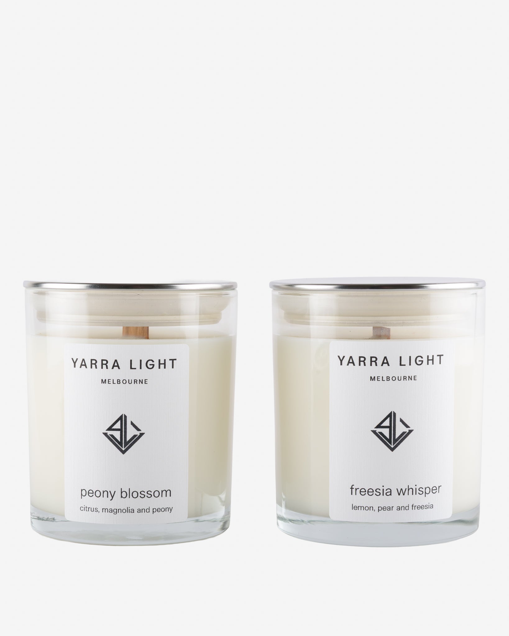 Two Yarra Light soy wax candles on a white background
