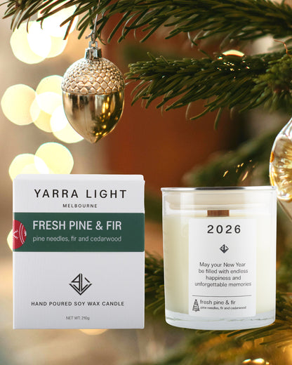Yarra Light Fresh Pine & Fir candle and packaging on a Christmas tree background