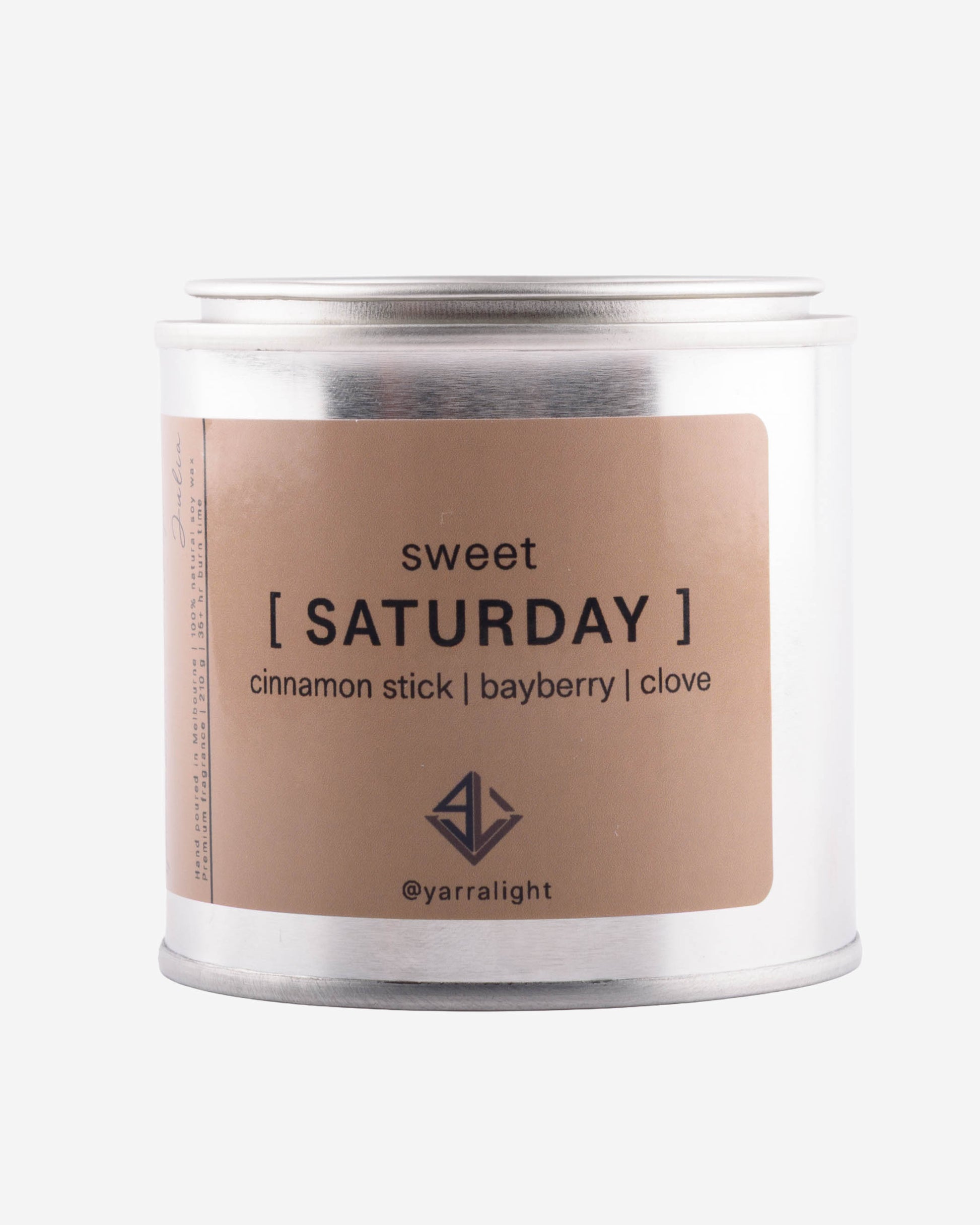 Hand poured soy wax scented candle labeled 'sweet saturday' on a white background