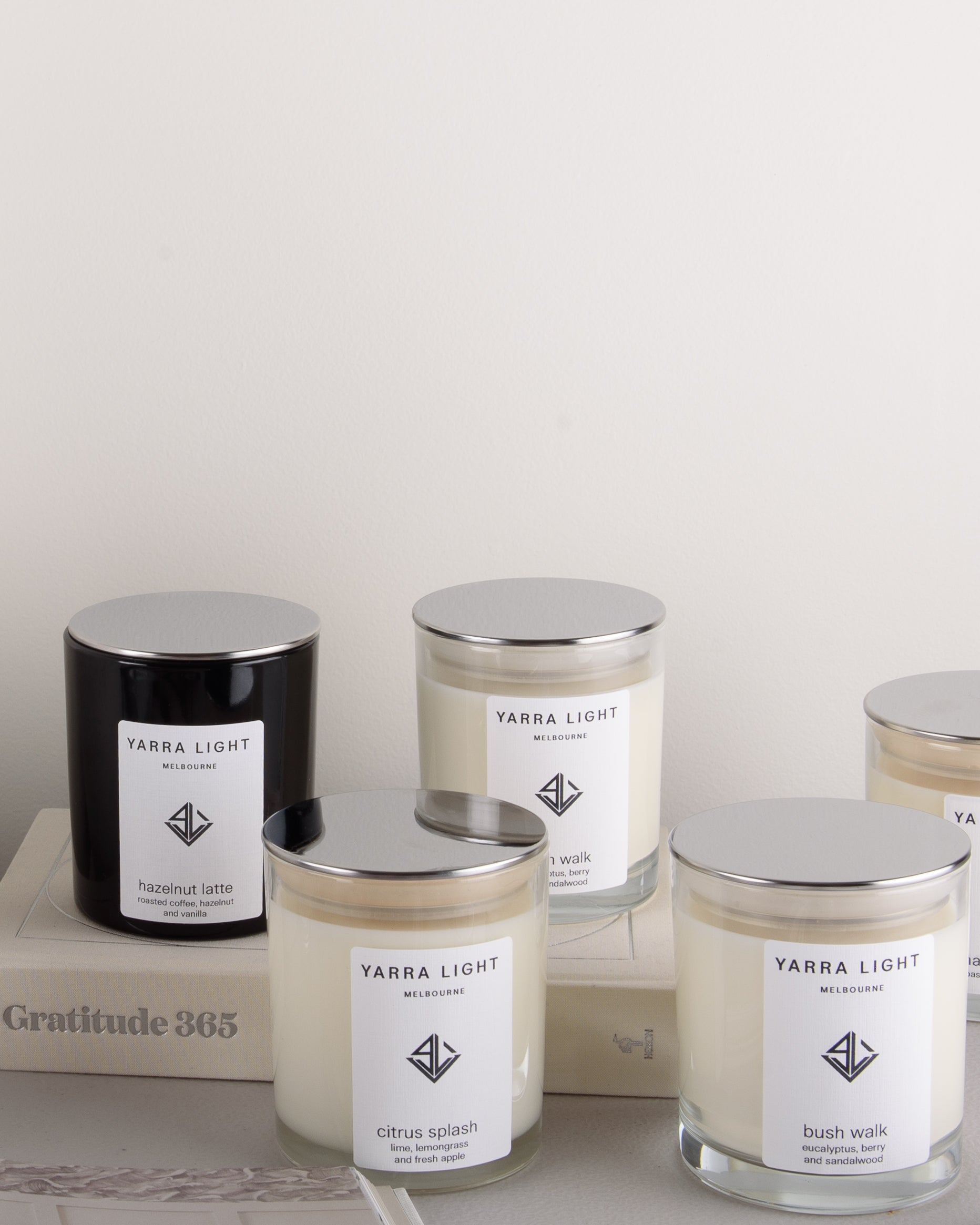 Collection of Yarra Light soy wax candles on a neutral background