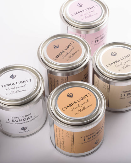 Yarra Light soy wax scented candles with various labels on a light background