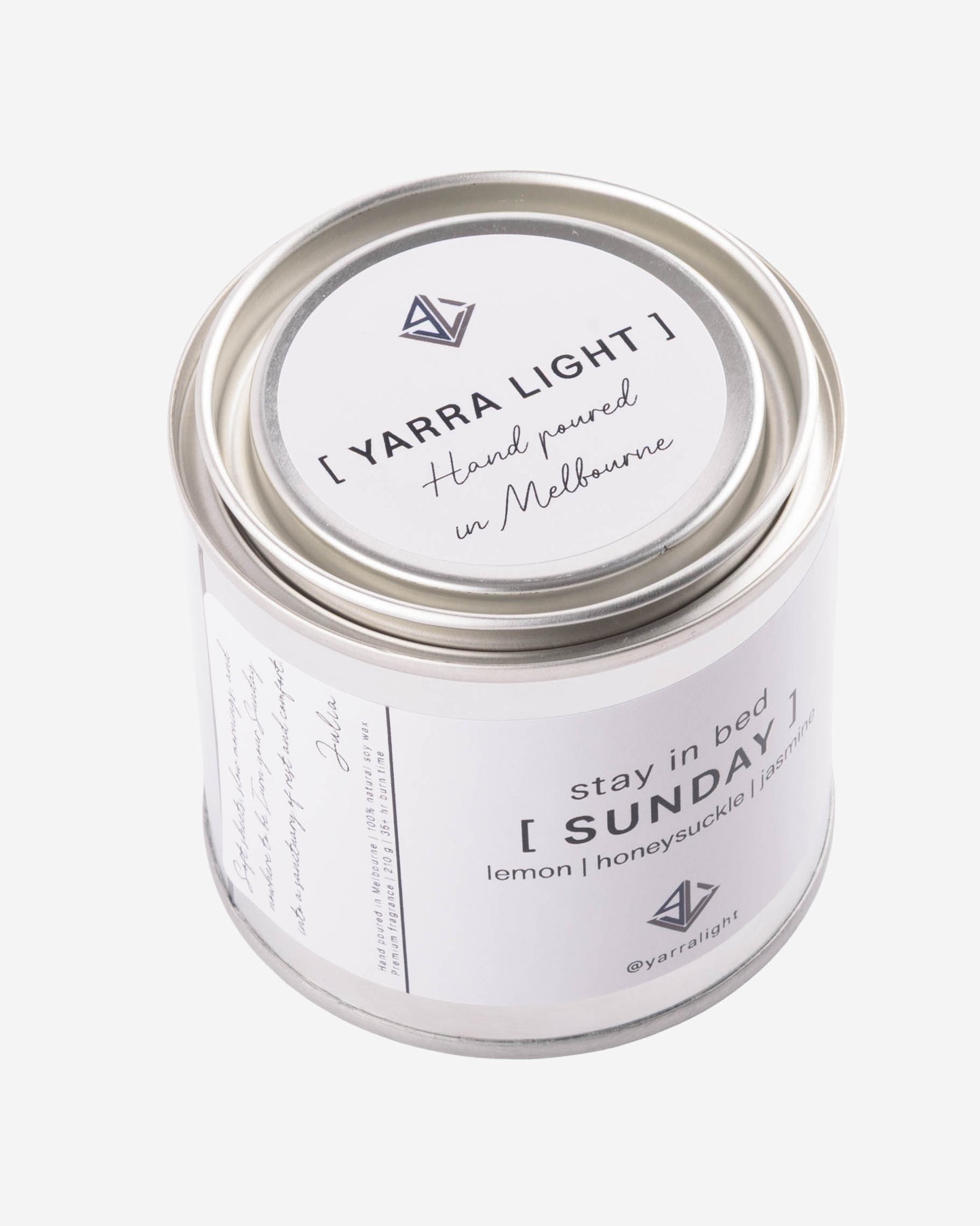 Yarra Light soy wax candle jar with white label on a light gray background