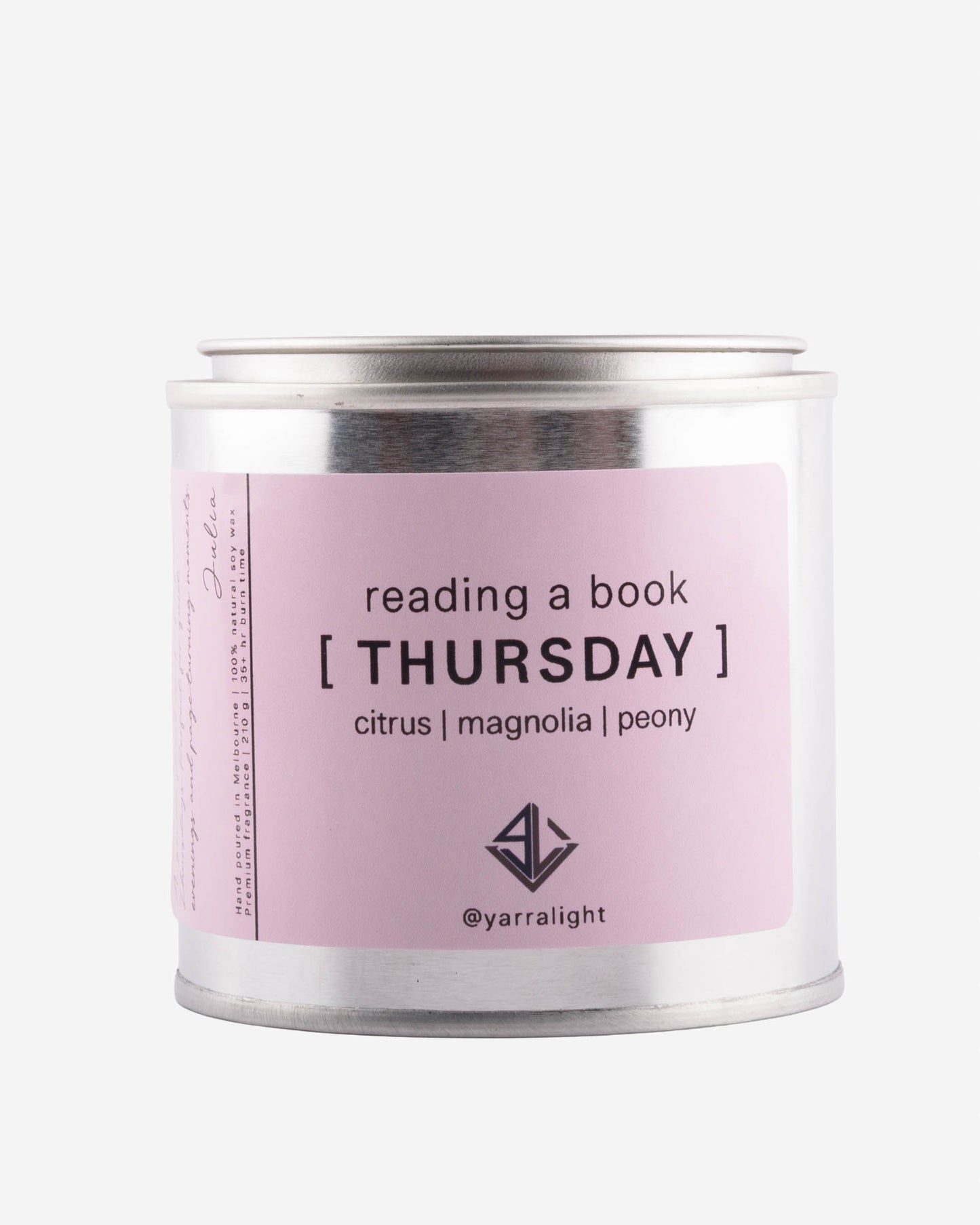 Candle tin labeled 'Thursday' with a pink label on a white background