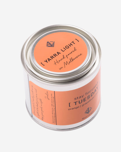 Yarra Light soy wax candle in a white container with a pink label on a light gray background