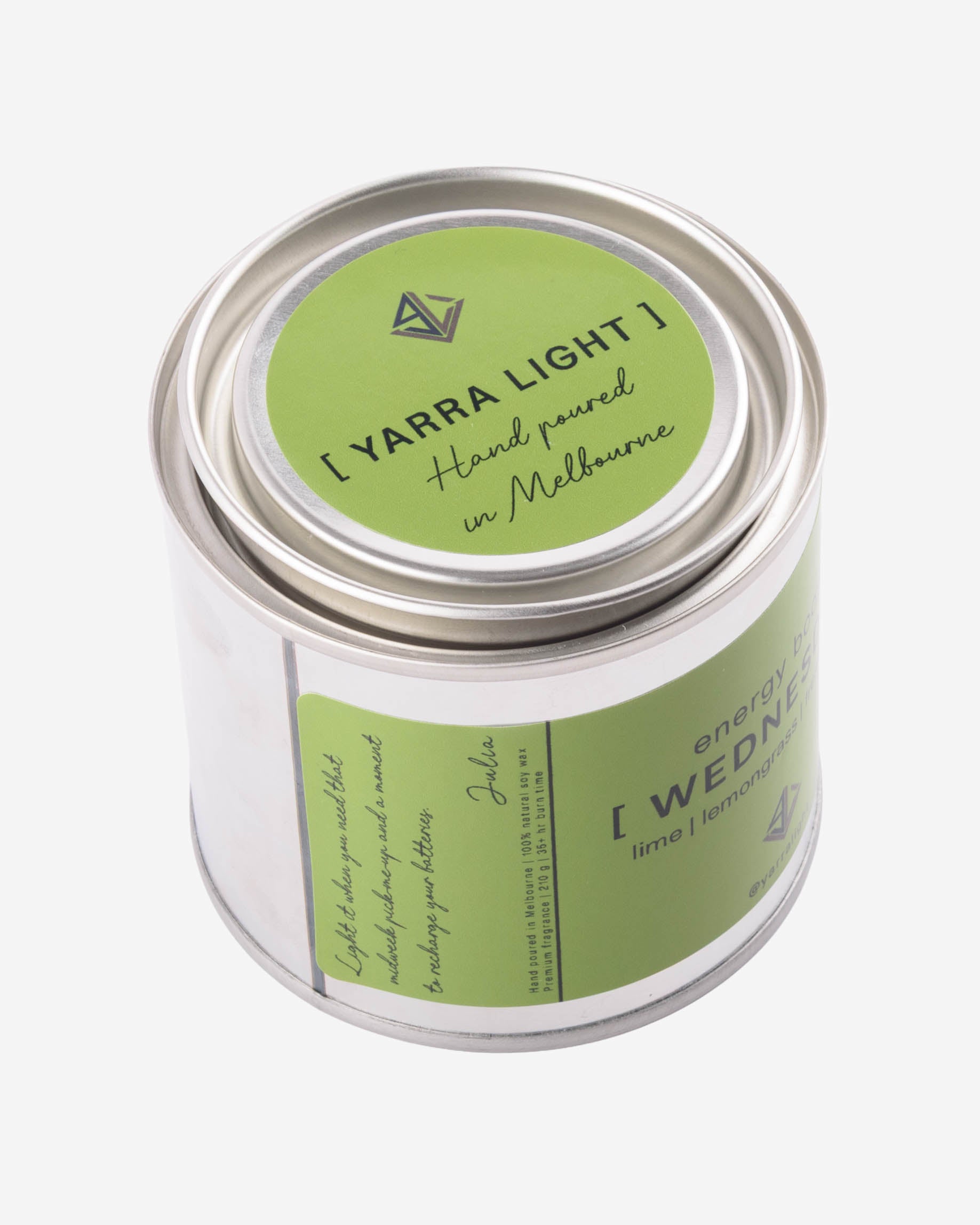 Yarra Light soy wax candle jar with green label and silver lid on a white background