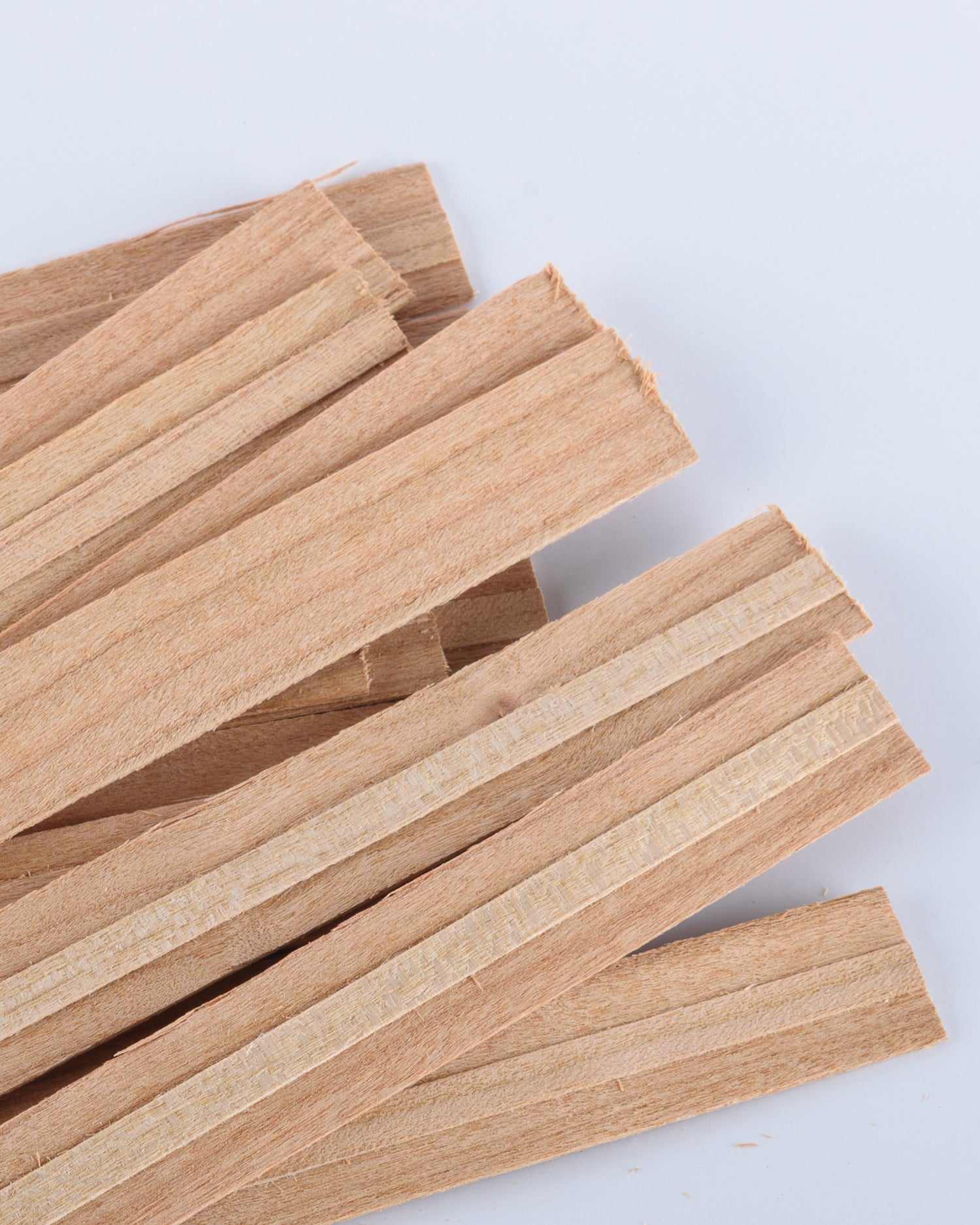 Wooden wicks on a white background